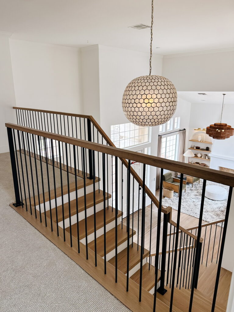 The view of the stairs from the second floor. 