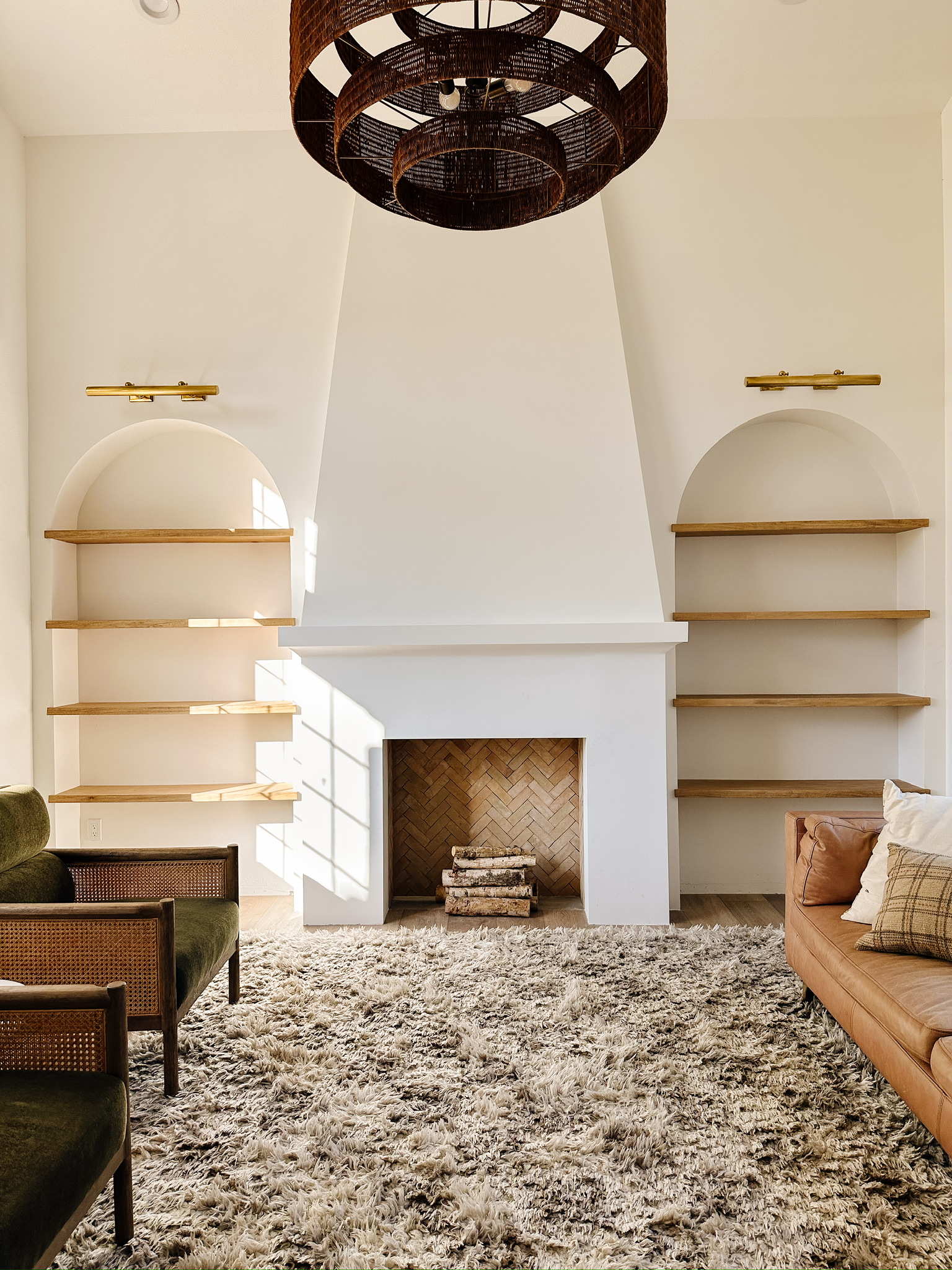 Image of the fireplace front room with empty shelves.