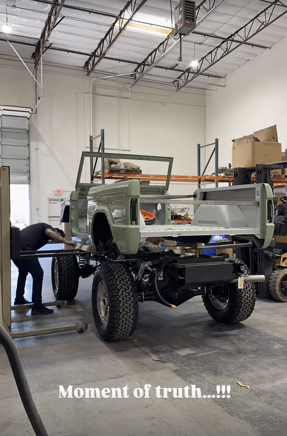 Instagram story screenshot of frame being bolted to chassis.